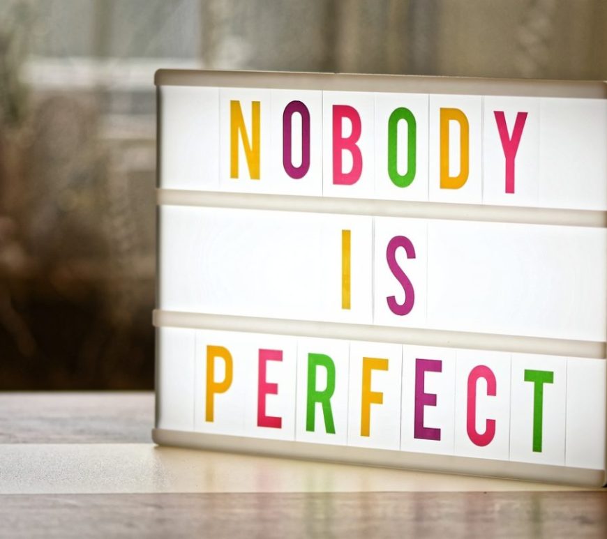 Light box sign with text "Nobody is Perfect".