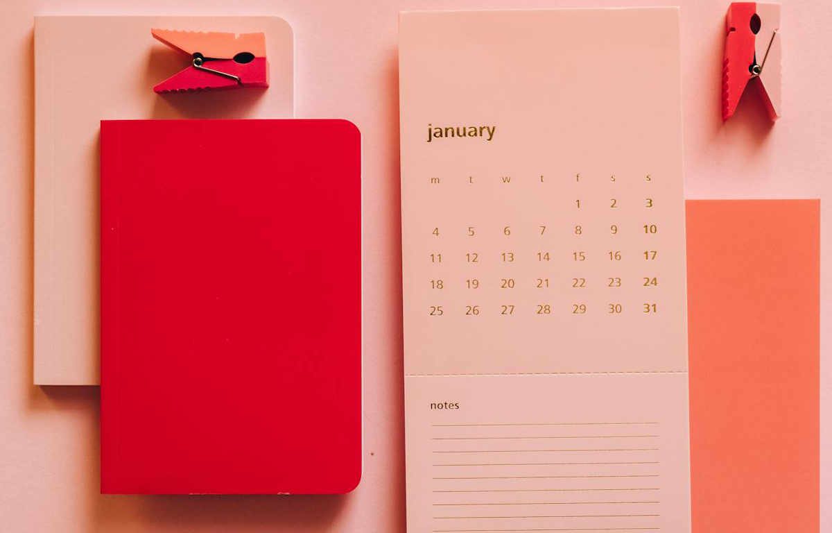 Stationary in peach and coral tones. Notebooks and monthly calendar with a tear-off notes section.