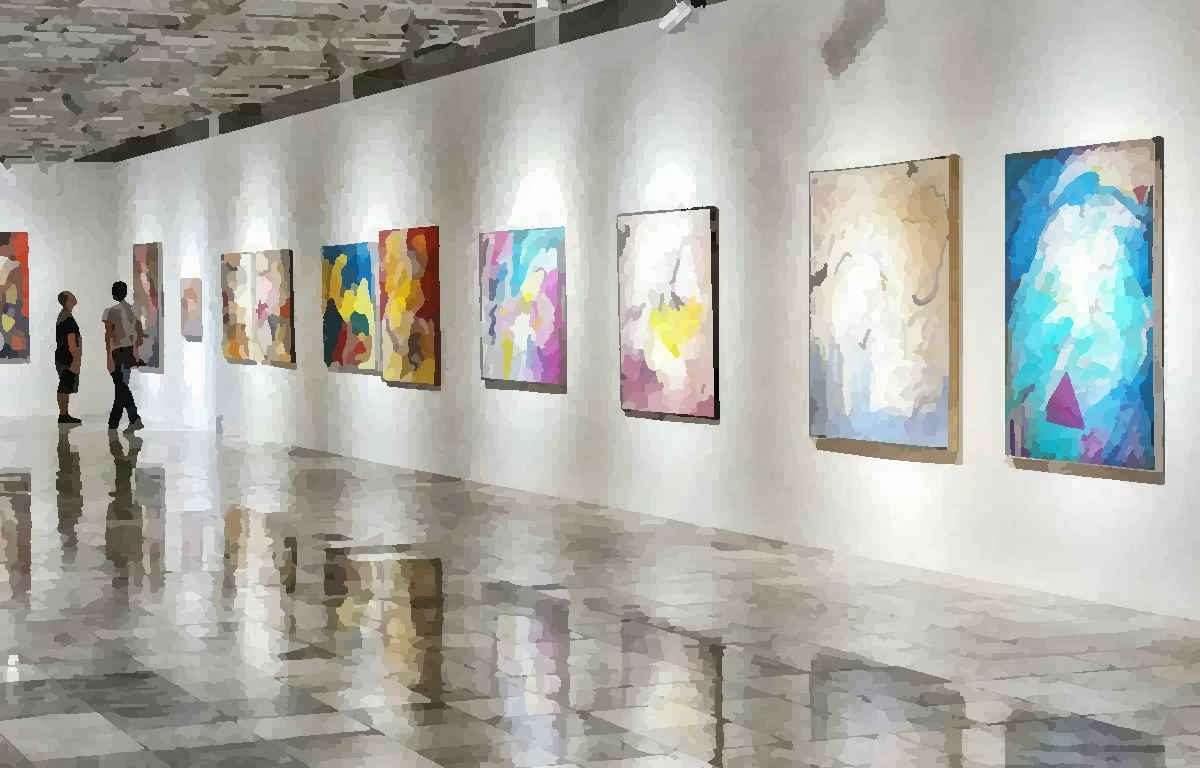 Two adults strolling through an arts gallery with paintings on the wall.